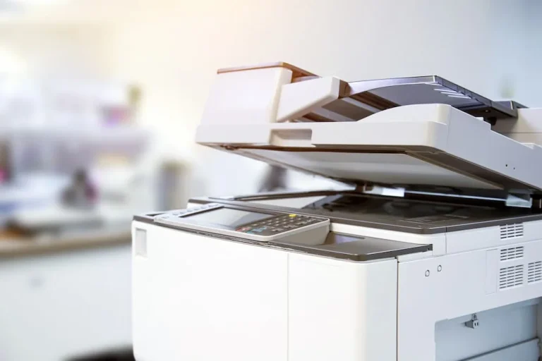 Close up of photocopier, with office backdrop